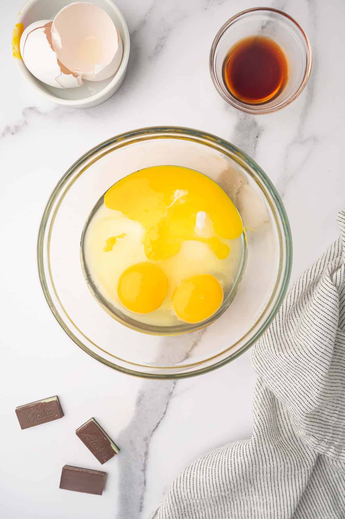 Eggs and white sugar combined for Andes Chocolate Mint Brownies