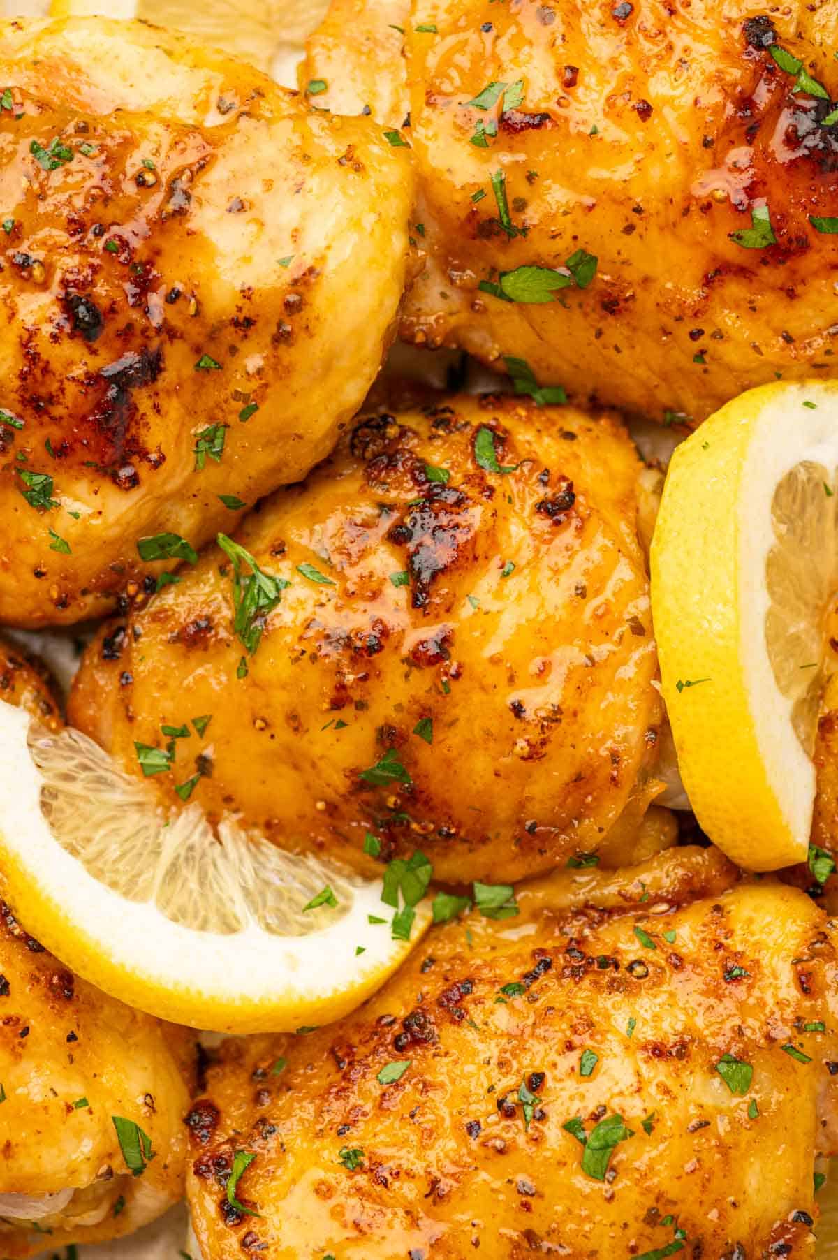 CLose up shot of baked lemon pepper chicken thighs