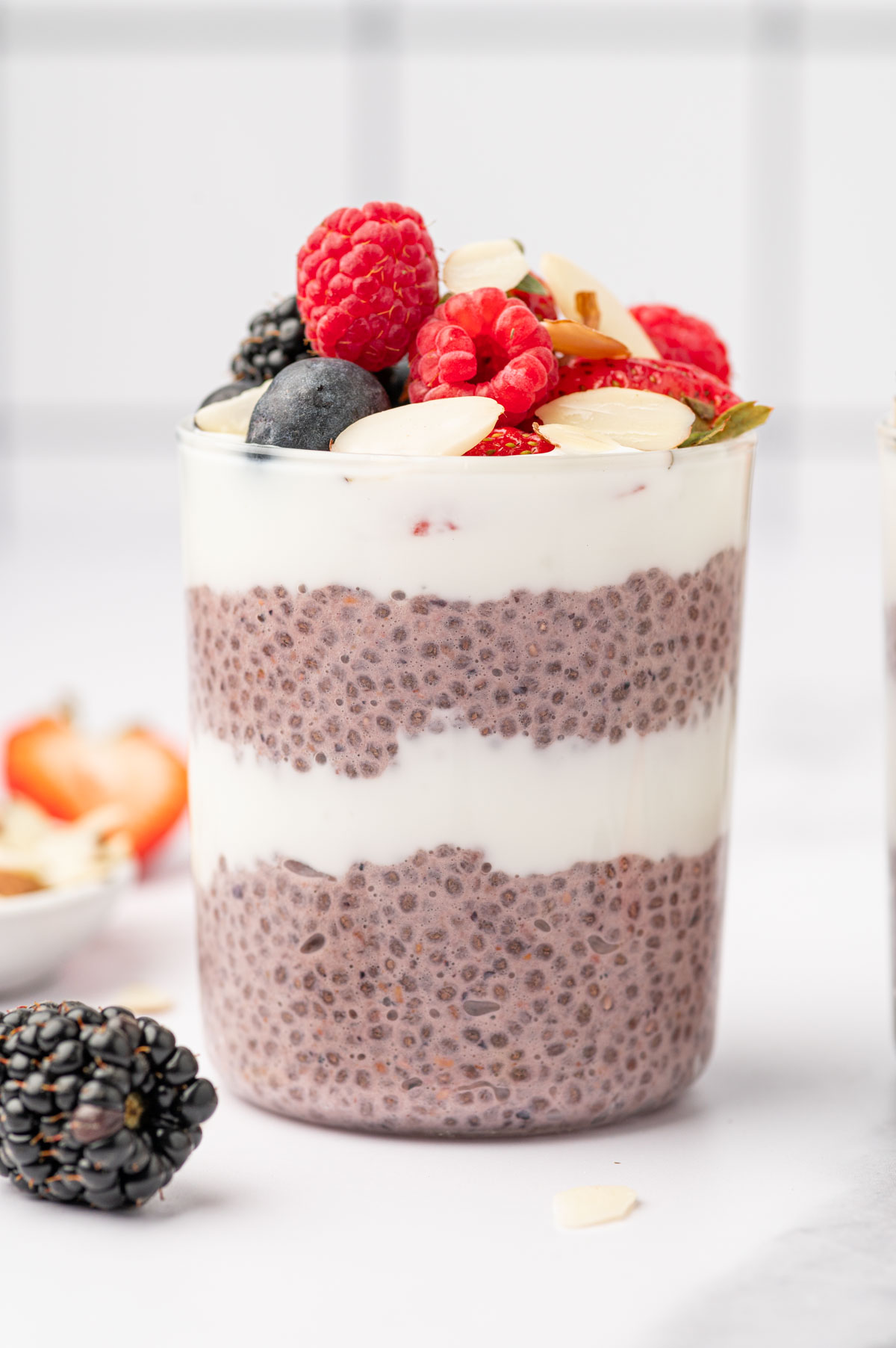 Berry chia pudding layers topped with berries