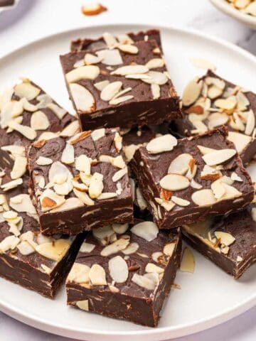 Wide shot of dark chocolate fudge with almonds