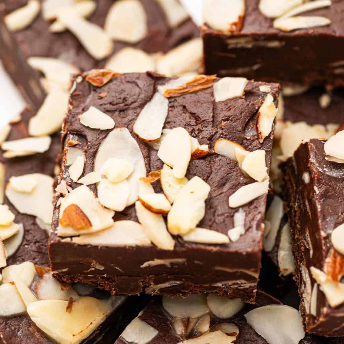 Close up shot of dark chocolate fudge with almonds