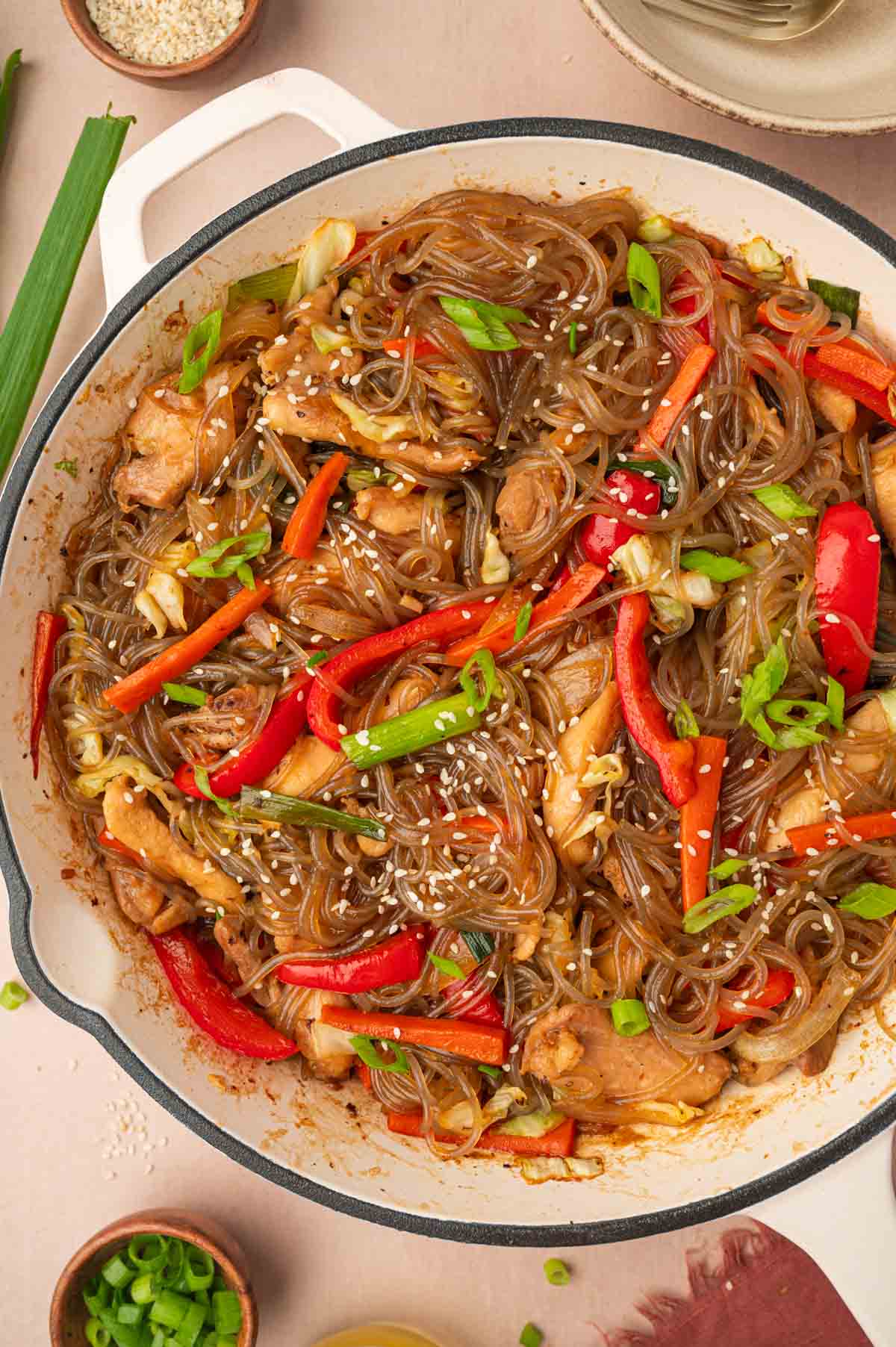 chicken glass noodles stir fry in a skillet