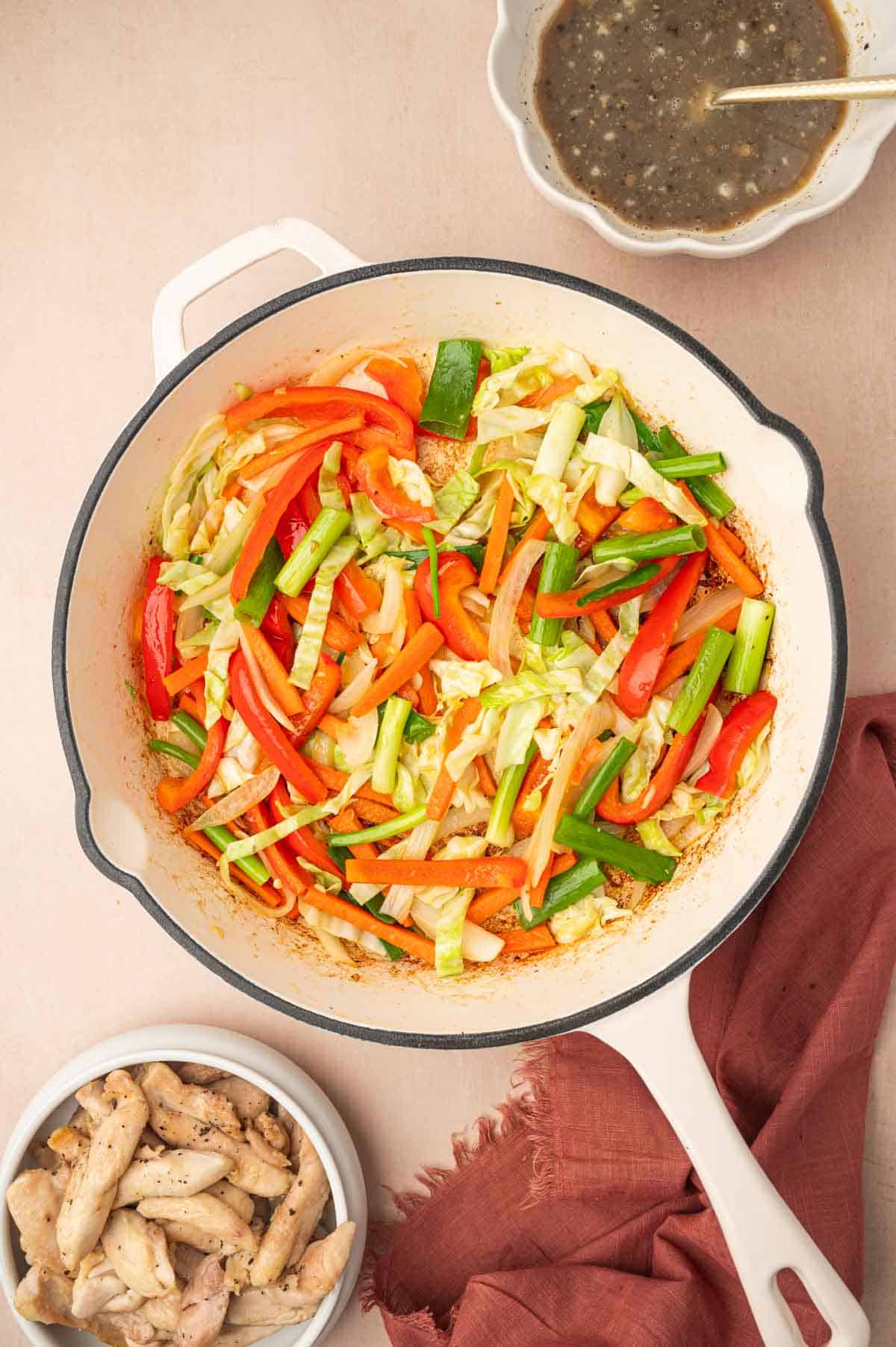 Cooked veggies for stir fry in a skillet