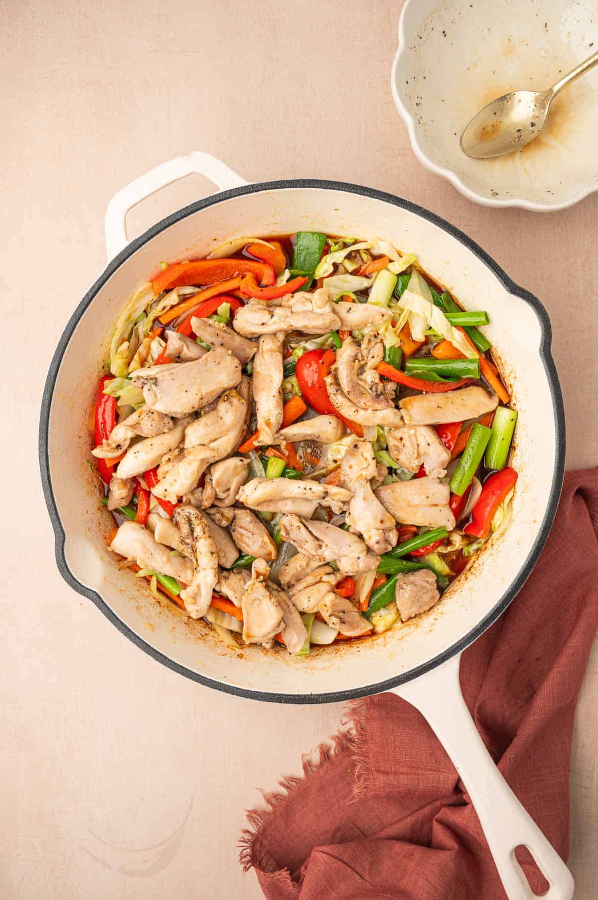 chicken and cooked veggies in a skillet