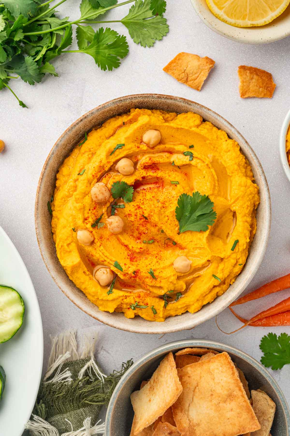 Roasted carrot hummus with canned chickpeas-flat lay shot.