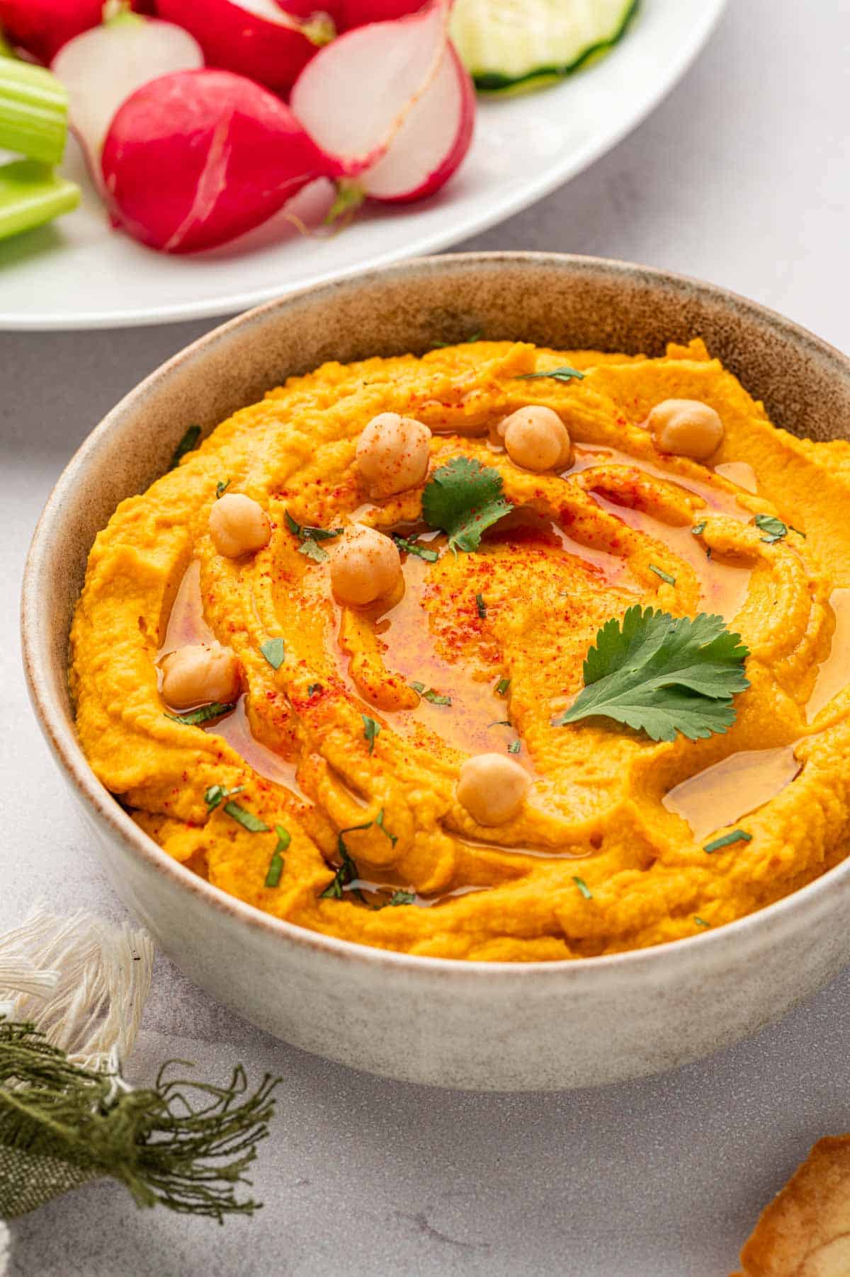 Roasted carrot hummus with canned chickpeas-backlighting shot