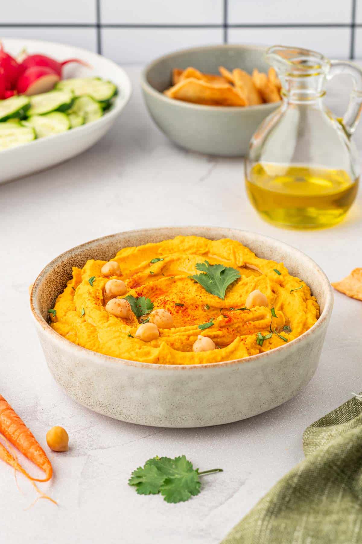 Roasted carrot hummus with canned chickpeas-on a kitchen backgrounds