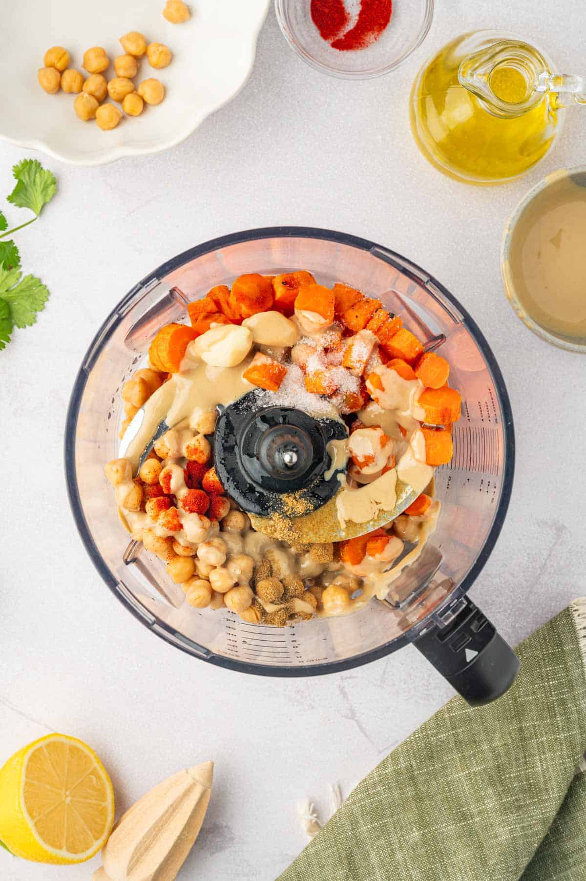 Roasted carrot hummus with canned chickpeas- add the ingredients to the food processor.