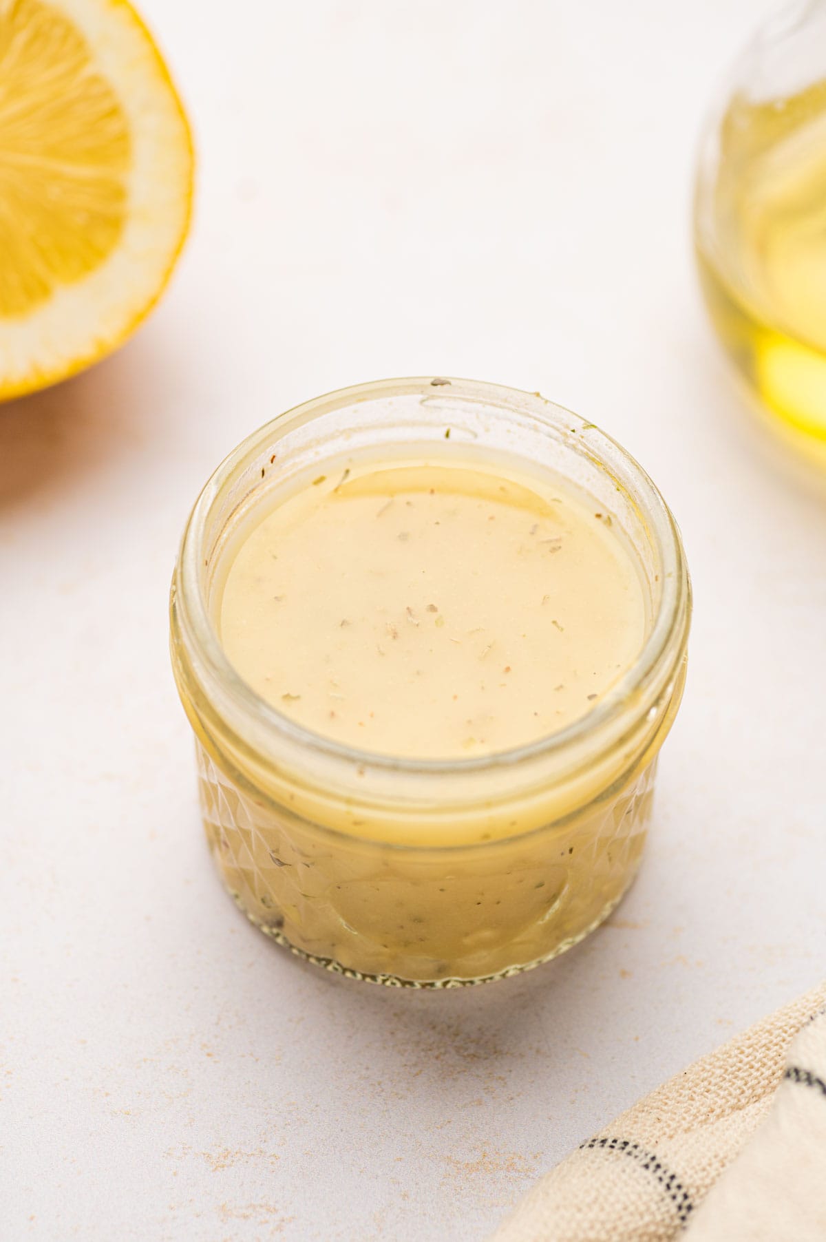 Prepare the lemon Dijon dressing for salmon kale quinoa salad