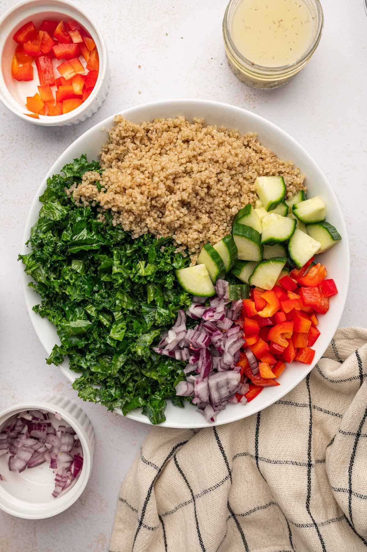 Assemble the salad ingredients for Salmon Kale Quinoa Salad