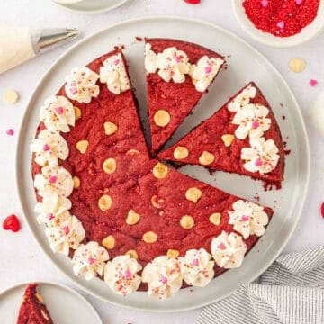 Red velvet cookie cake sliced and kept in a white plate