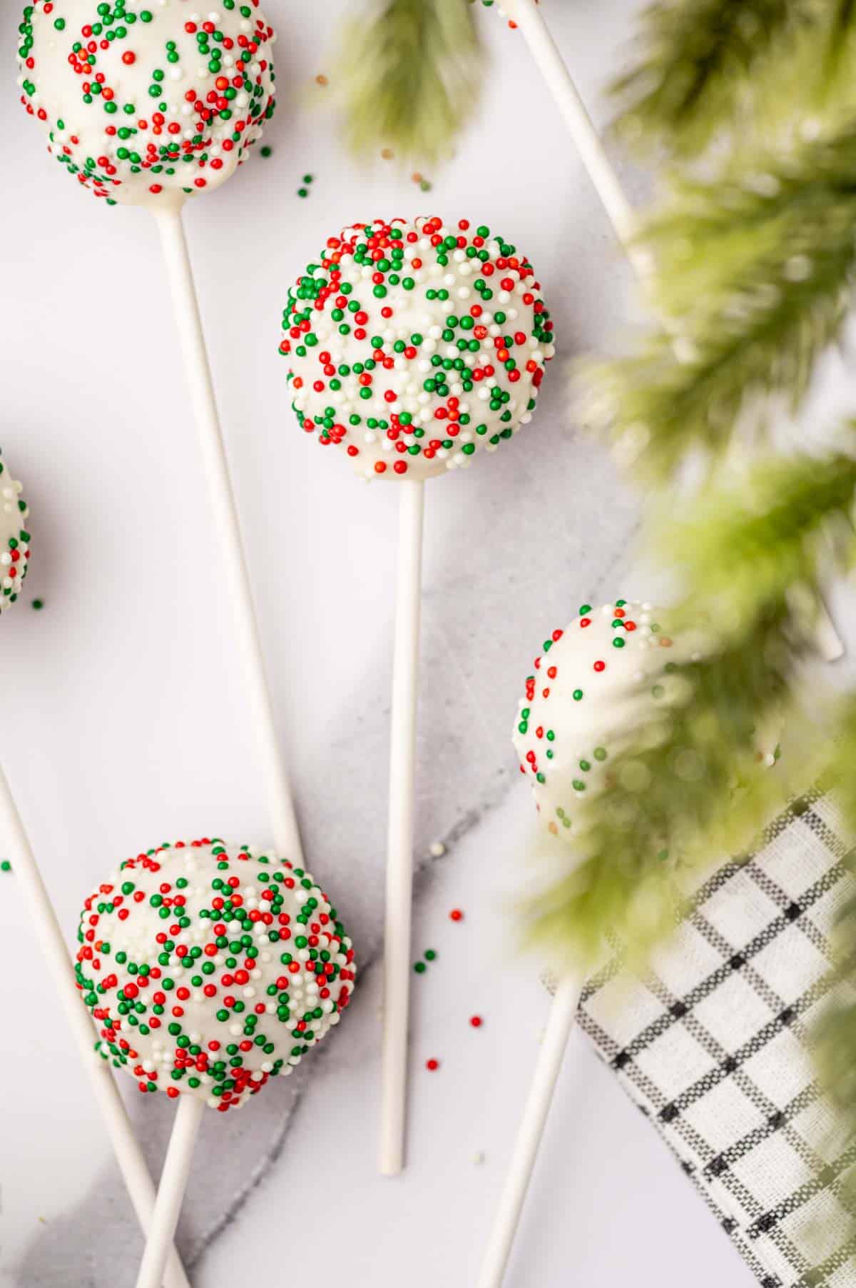 Christmas Cake Pops layed in a marble tray