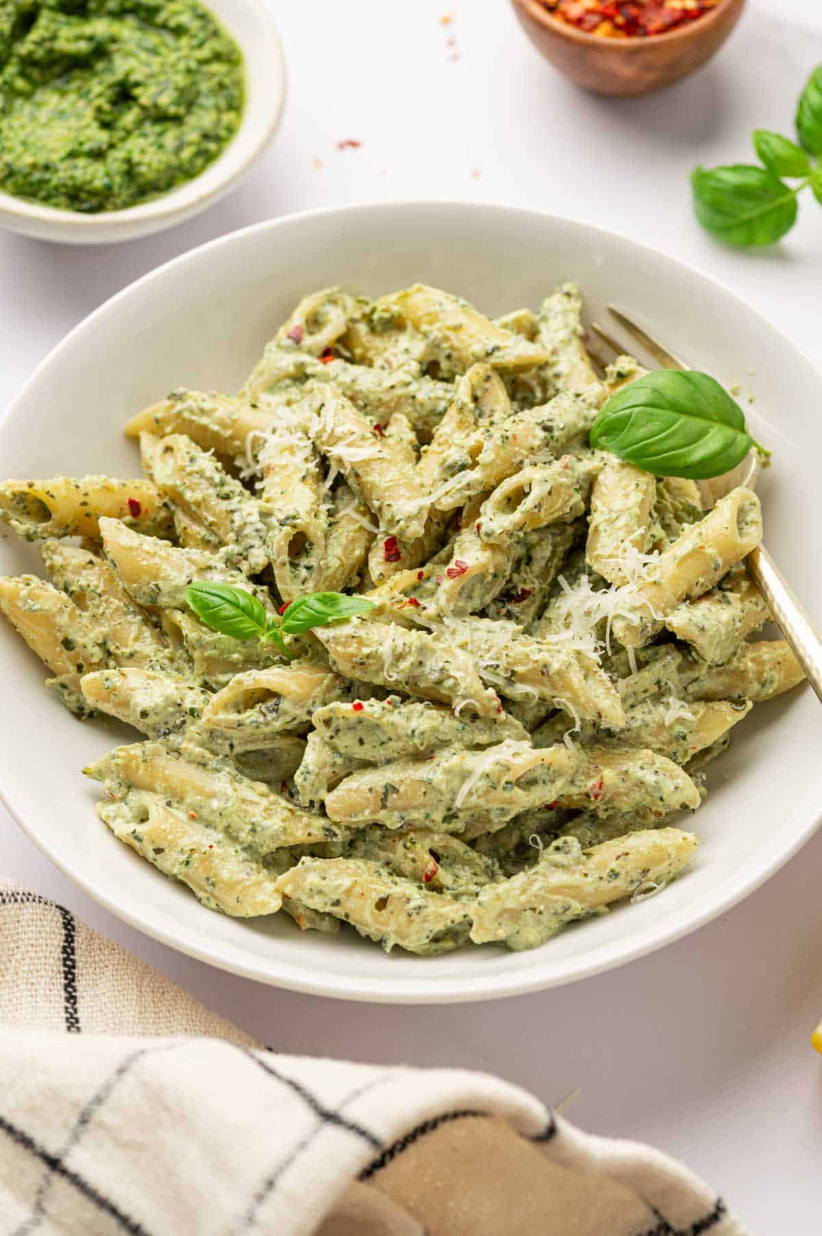 Peto pasta with ricotta in a white bowl