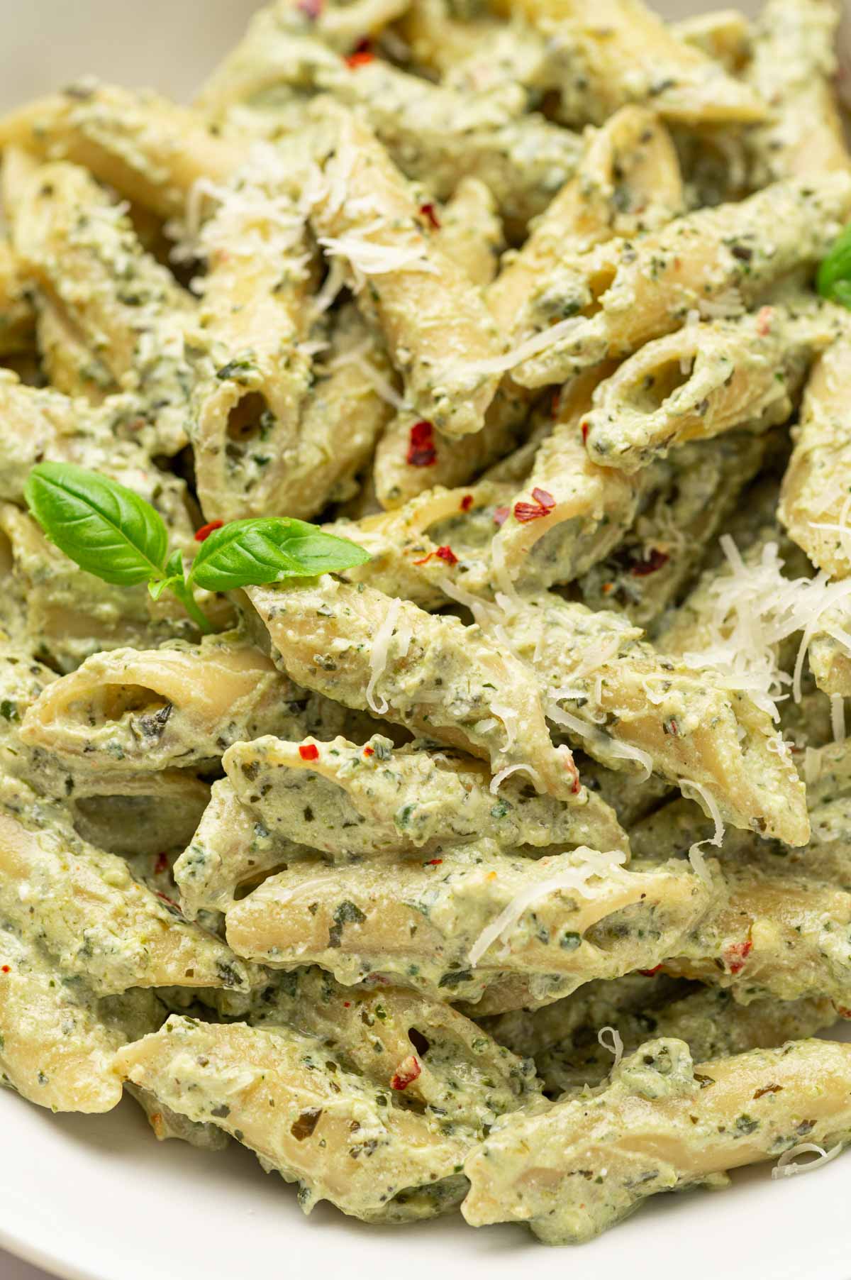 Pesto and Ricotta pasta in a white bowl 