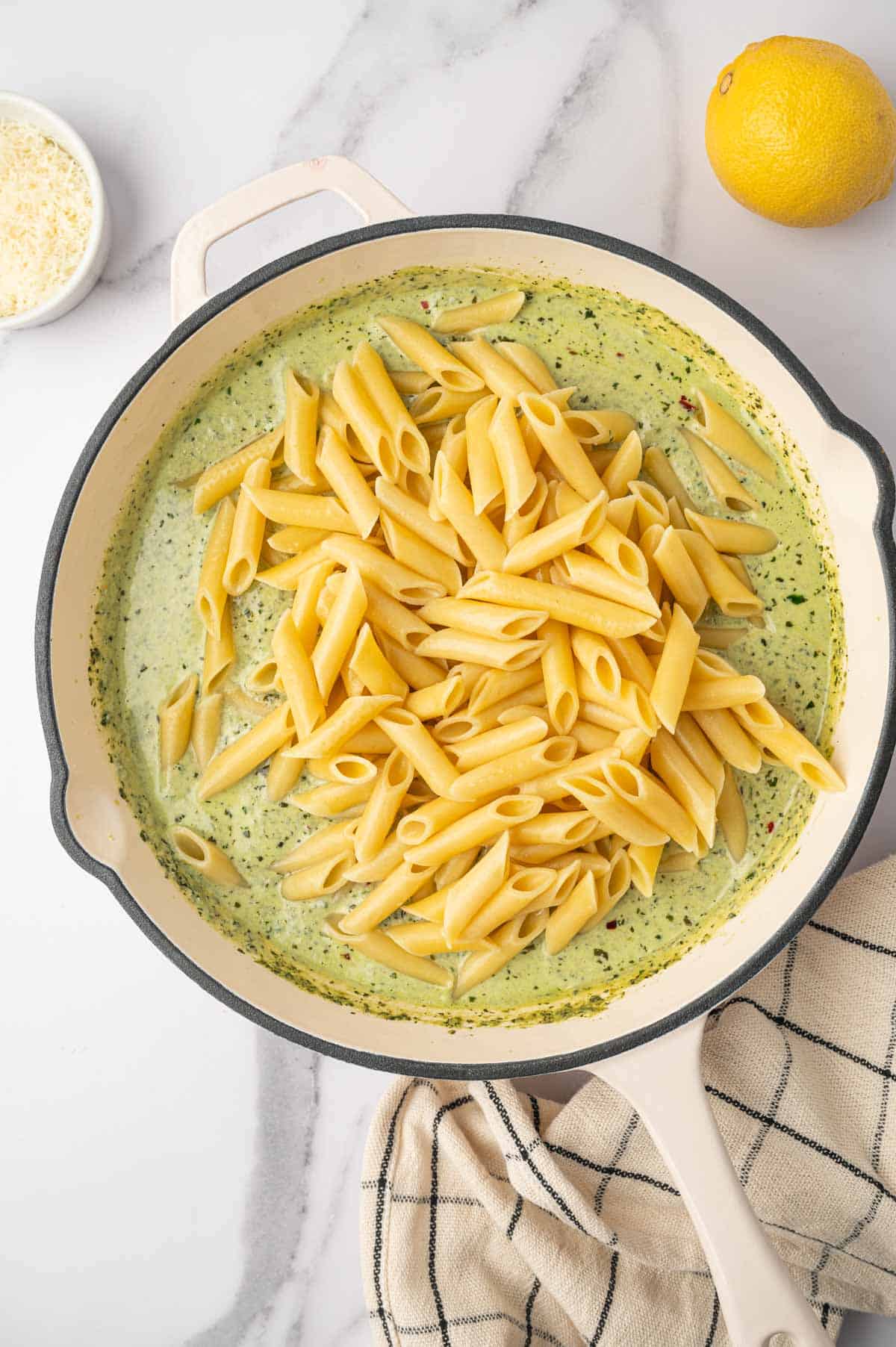 Pasta added to the pesto ricotta sauce