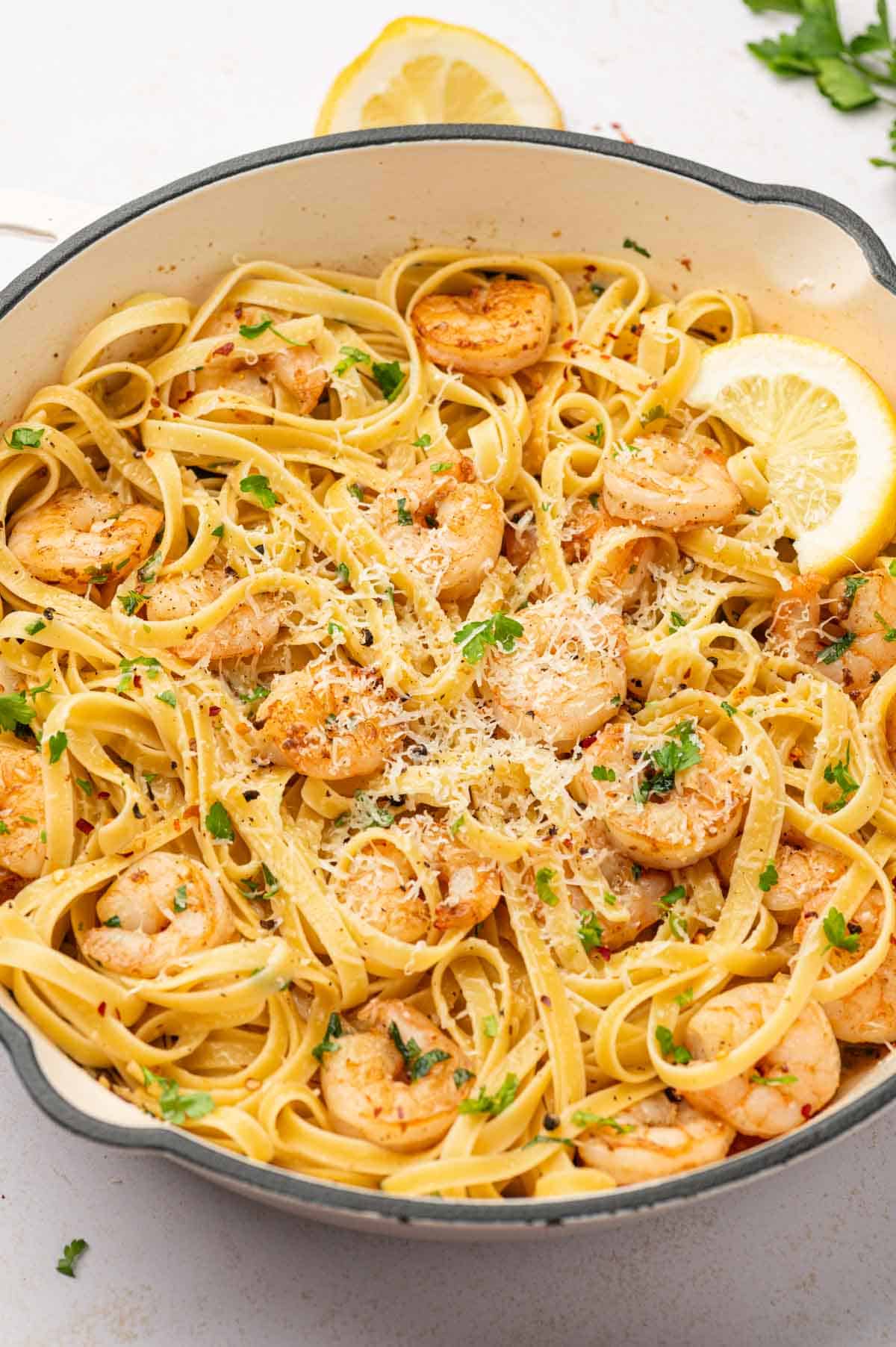 In a white skillet shrimp scampi fettuccine 