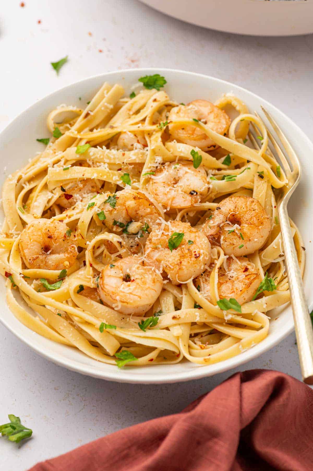 In a white bowl shrimp scampi fettuccine 