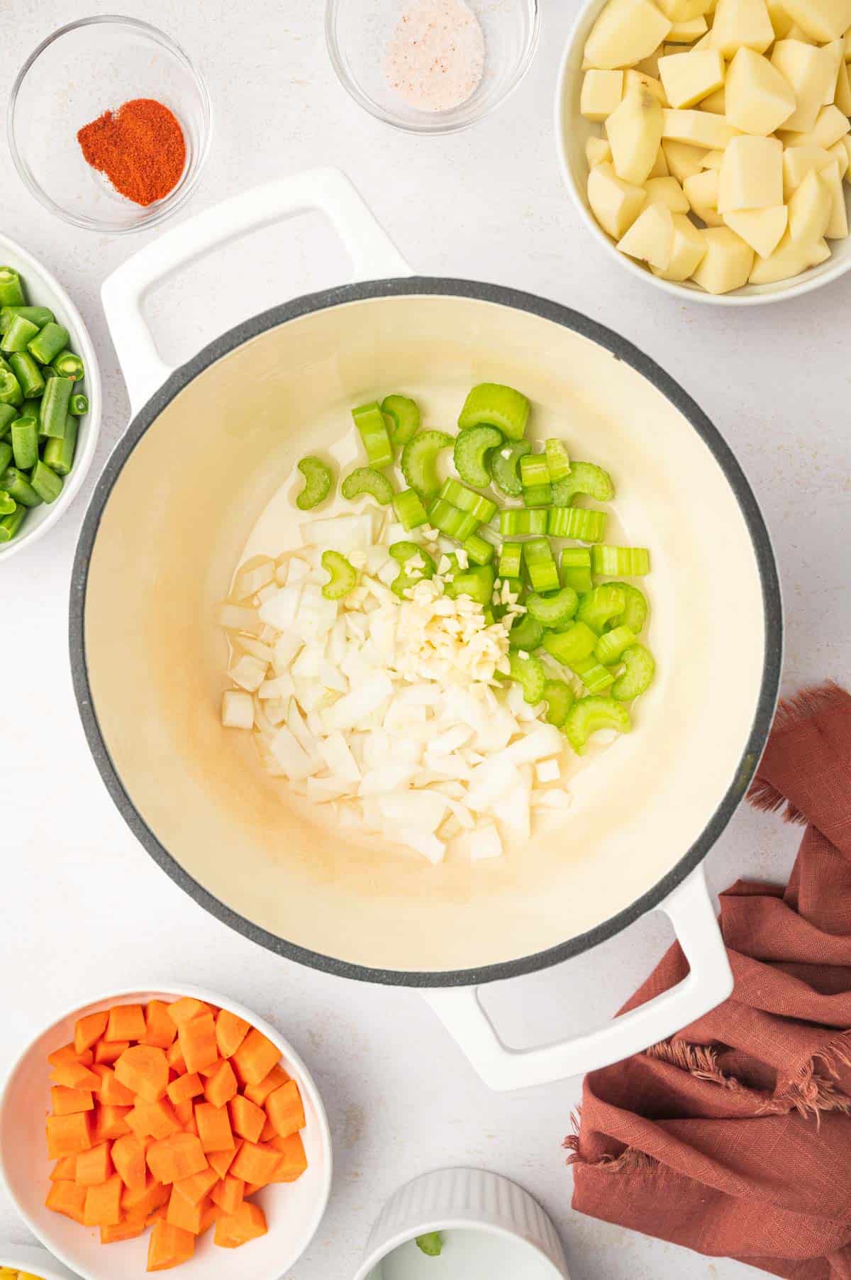 onion and celery in a dutch oven