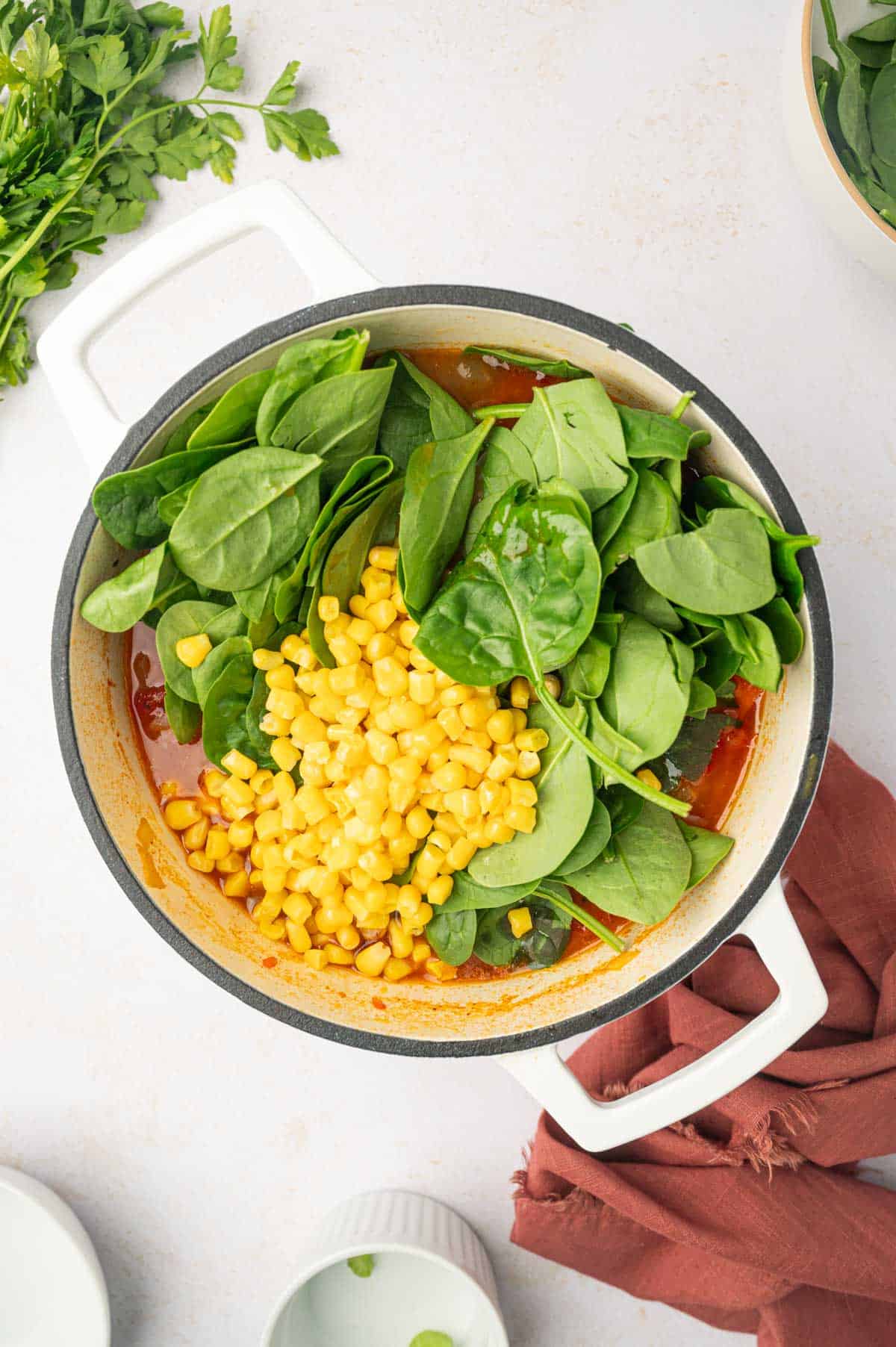 Corn and spinach added to the soup