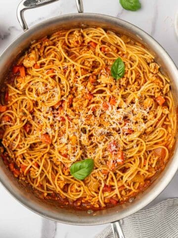 Finished Ground chicken spaghetti dish in a skillet