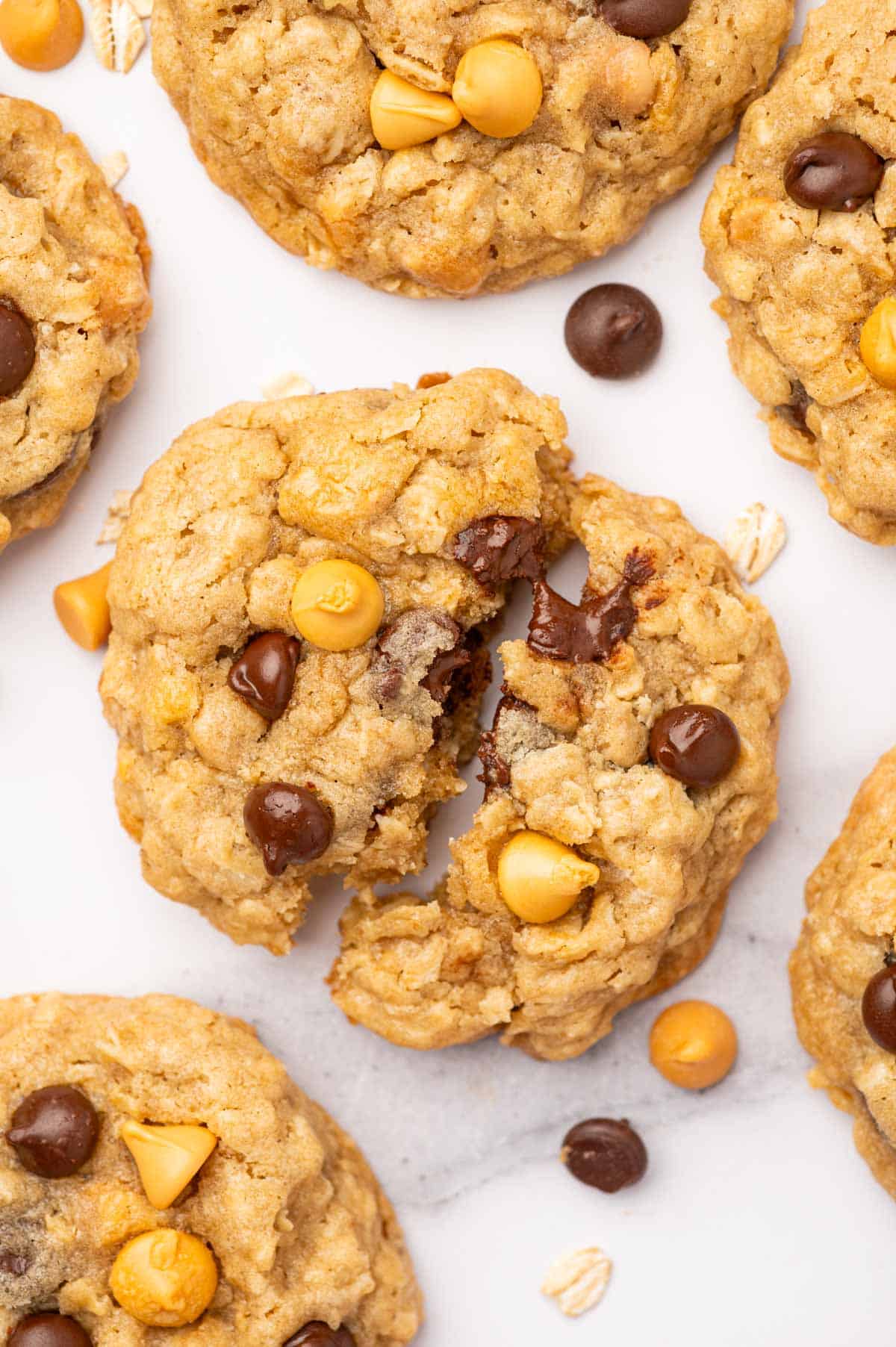 melted chocolate oozing out from the oatmeal cookies