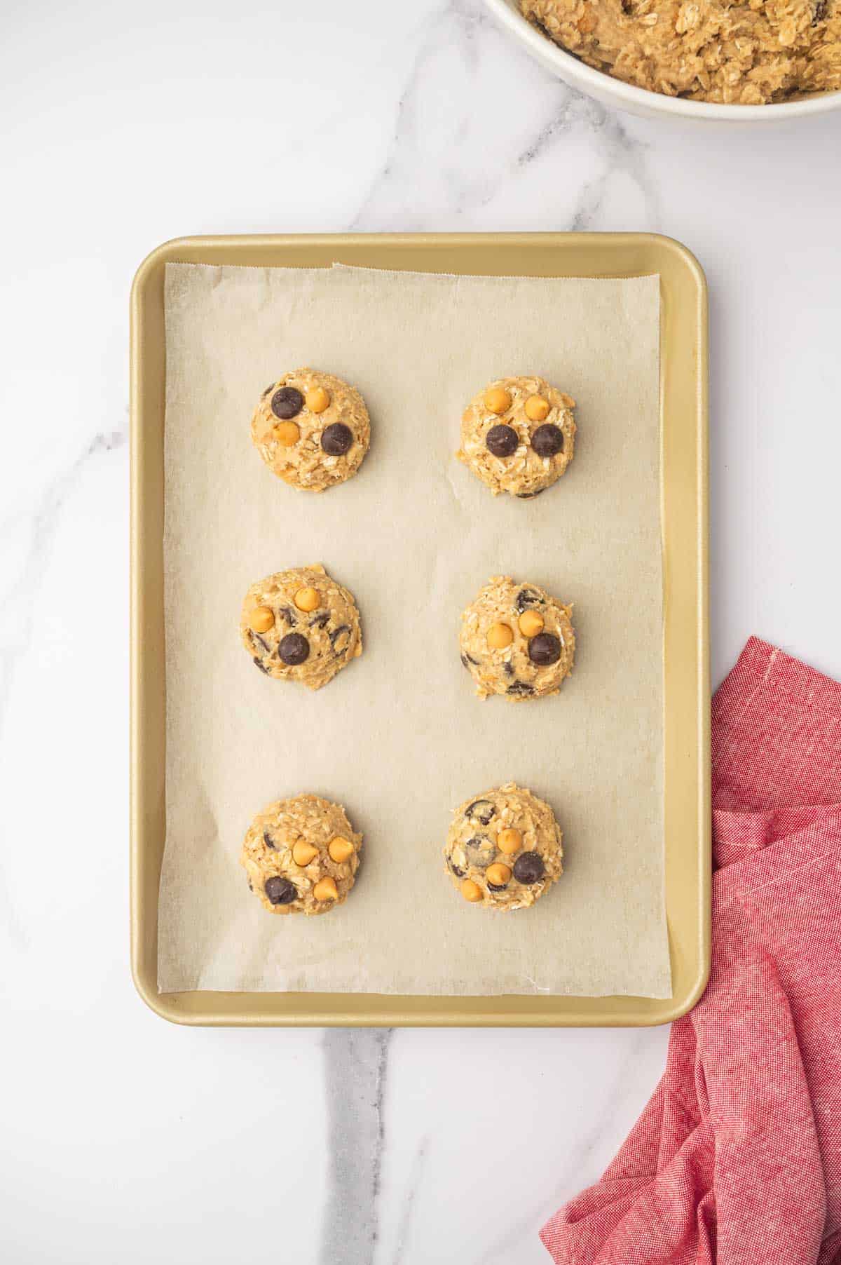 Oatmeal butterscotch chocolate chip cookie dough in a baking tray