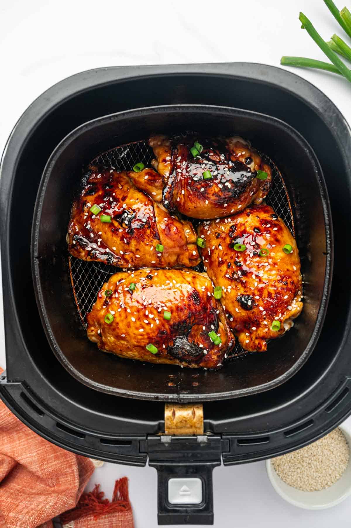 Quick and Easy Air Fryer Chicken Thighs with a Savory-Sweet Teriyaki Glaze.