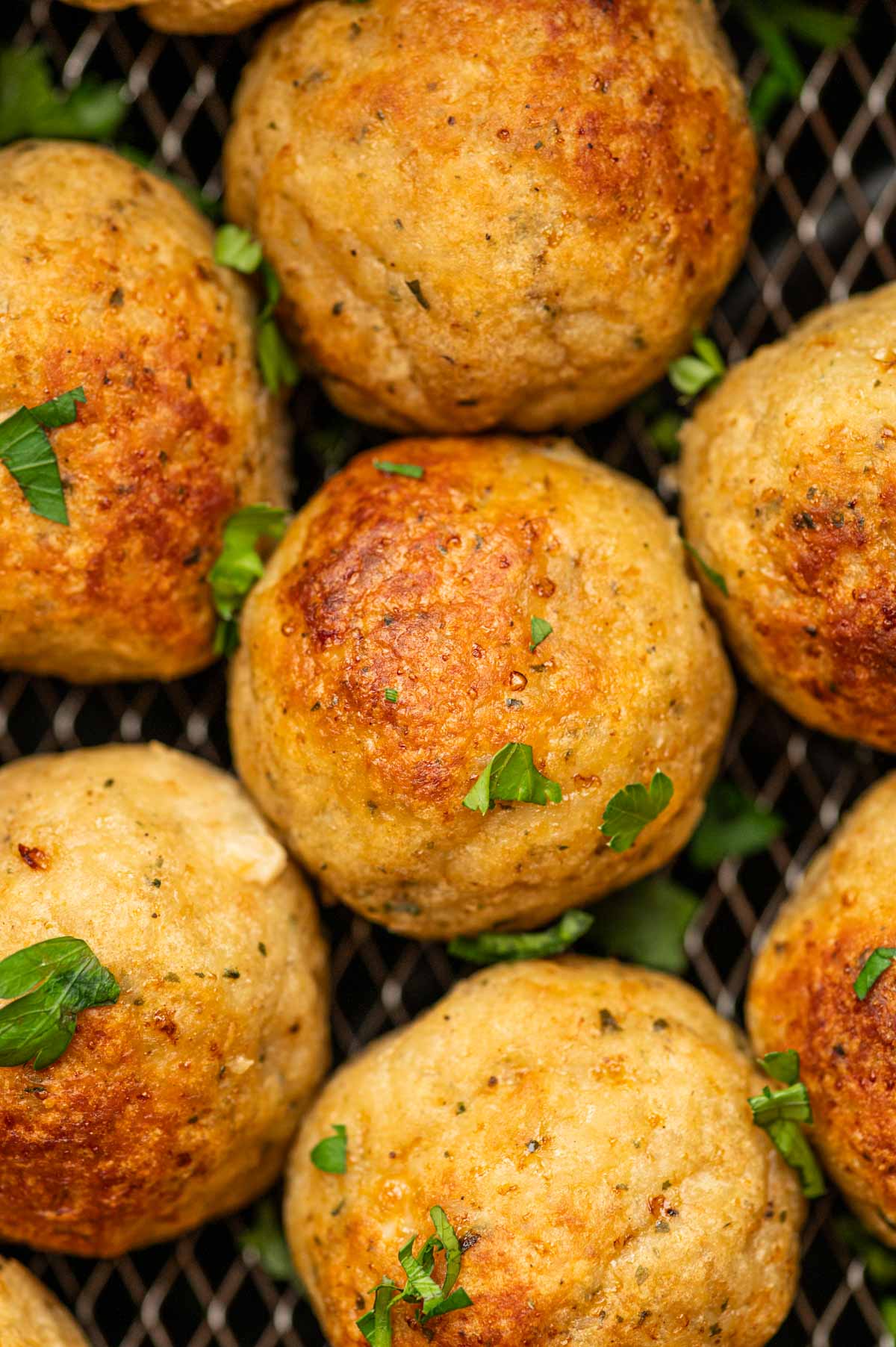 Close up shot of chicken Meatballs in the air fryer.