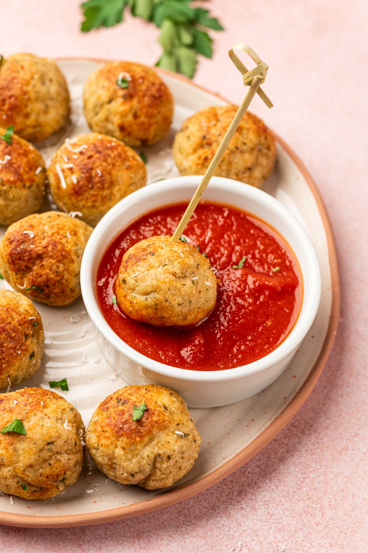 Air fried chicken meatballs dipped in the marinara sauce.