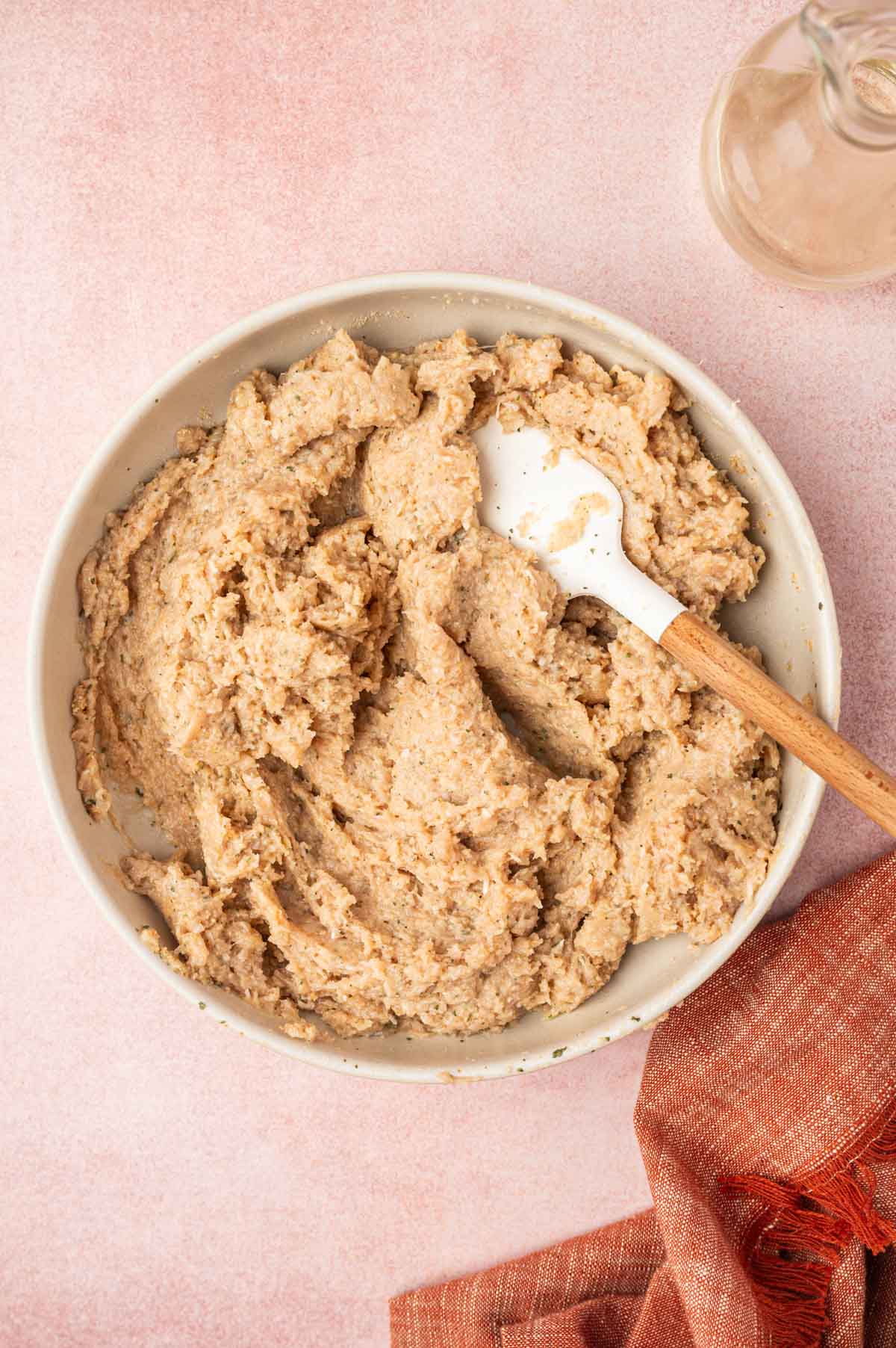 Chicken mixture in a white bowl for the BEST moist chicken meatball recipe.