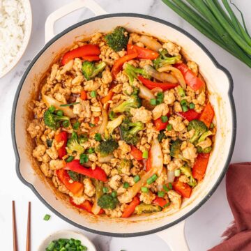 Healthy ground chicken stir fry in a skillet.