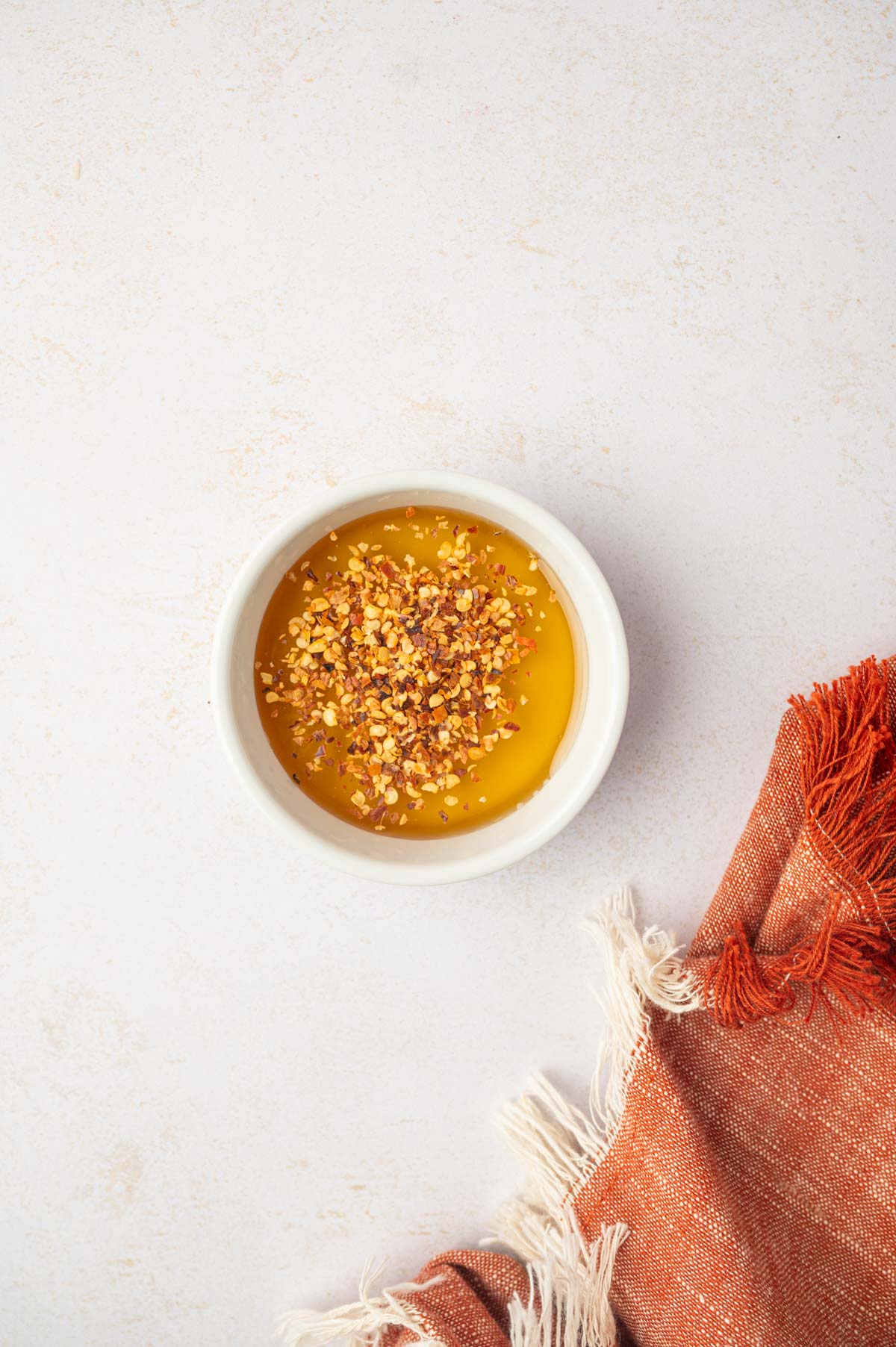 honey and red pepper flakes in a bowl