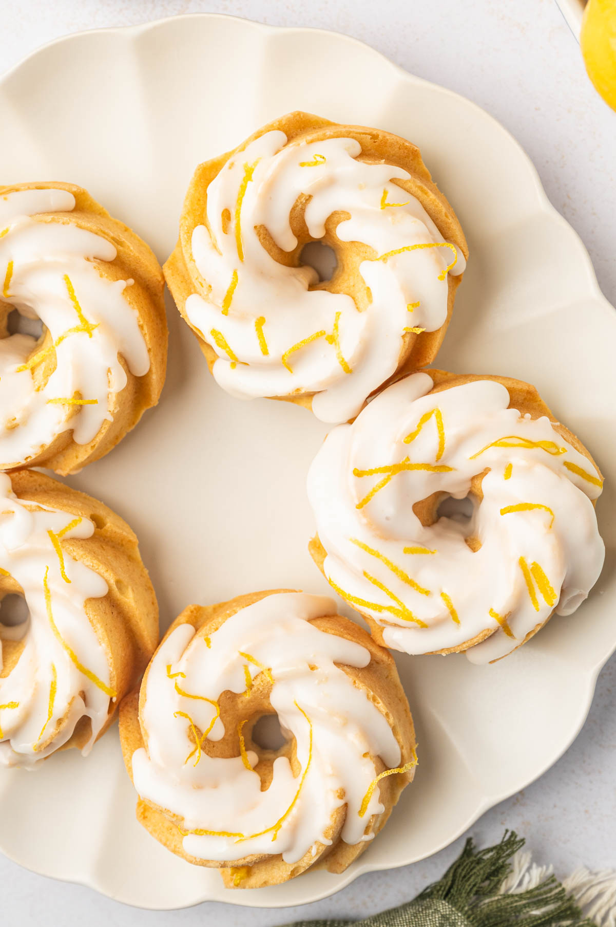 Lemon mini budnt cakes in a white plate.