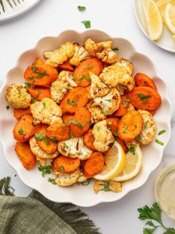 Healthy oven-roasted vegetables on a white bowl