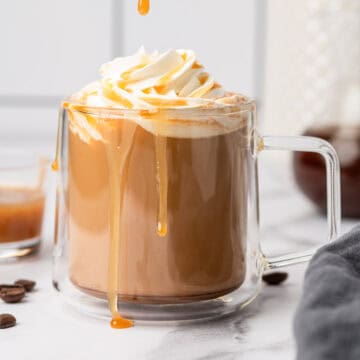 Creamy and delicious homemade salted caramel latte recipe in a glass mug.