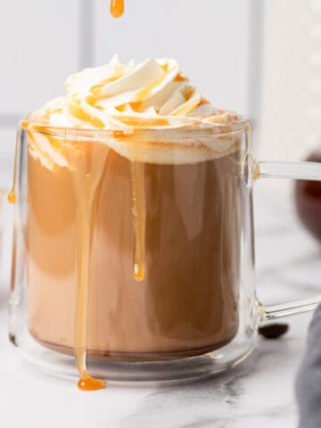 Creamy and delicious homemade salted caramel latte recipe in a glass mug.