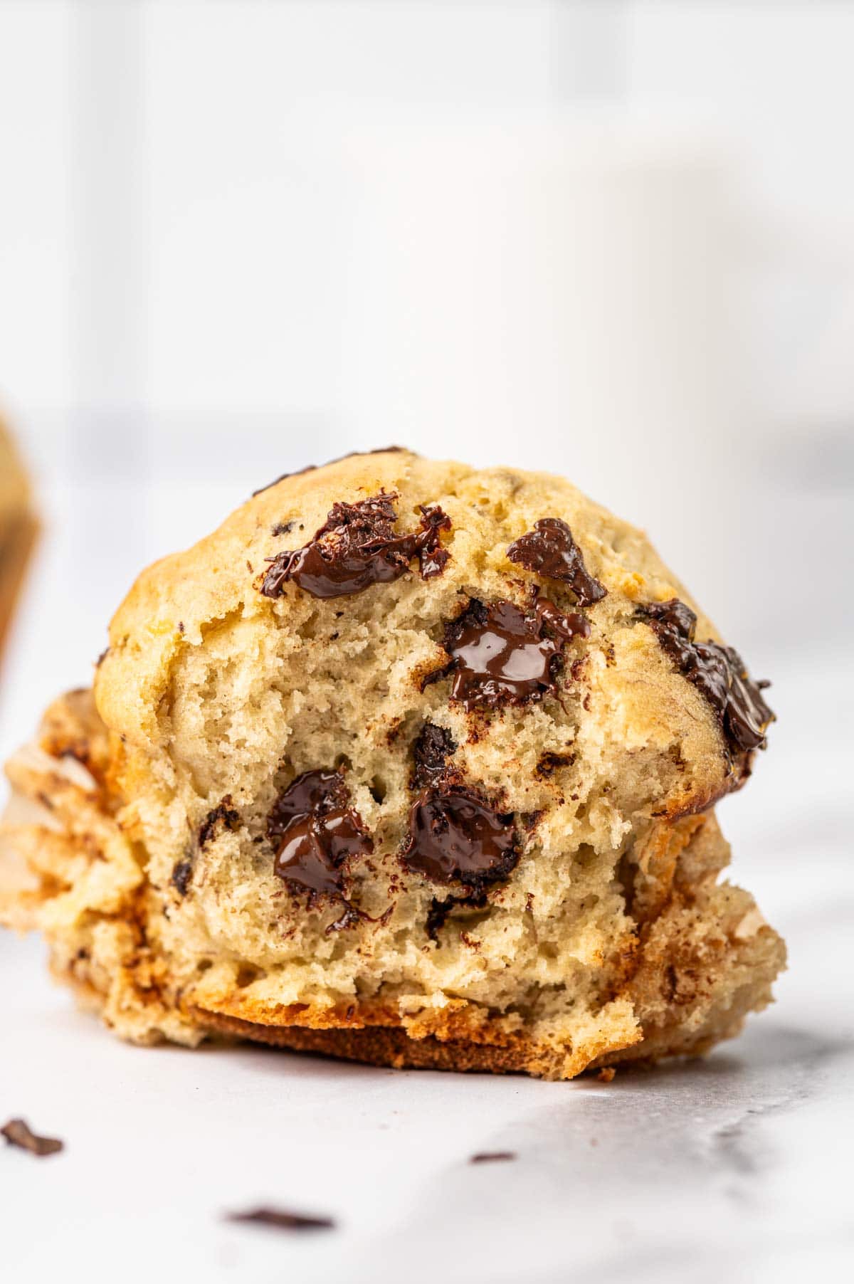 Showing the inner texture of the banana chocolate chunks muffins where chocolate oozing out.