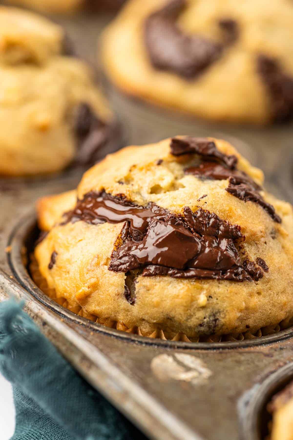 Close up shot of chocolate oozing from the banana chocolate chunks muffins.