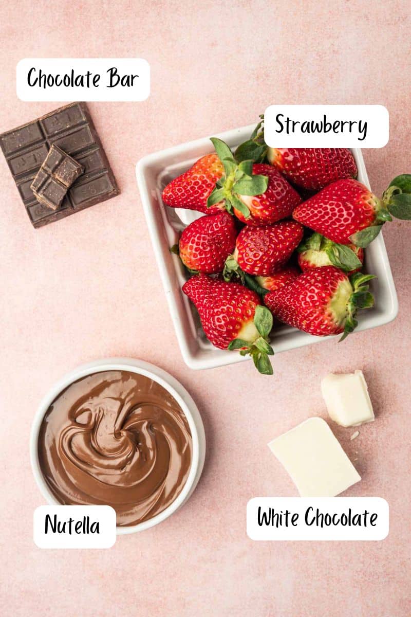 Ingredients laid out for Strawberry covered Nutella recipe in a pink hue background.