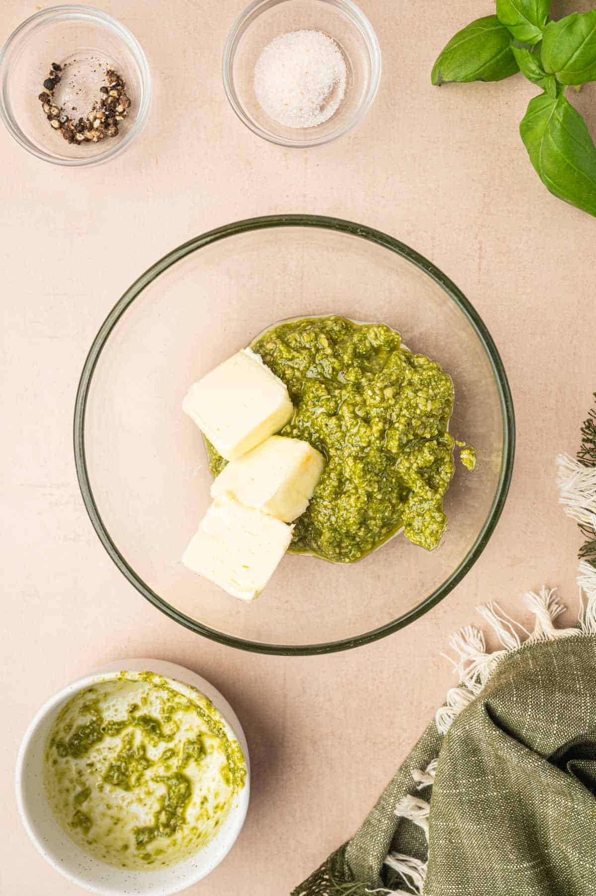 Pesto sauce and butter in a bowl.