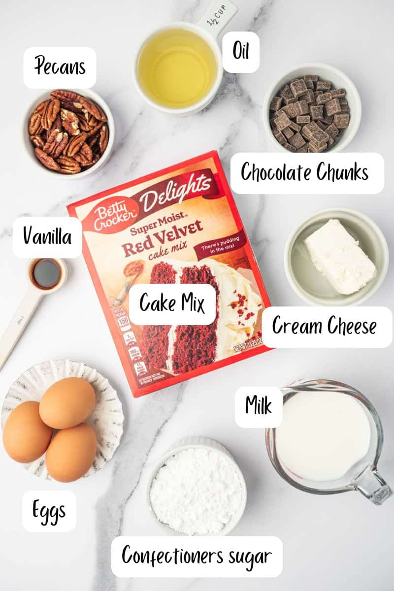 Ingredients laid out on a marble table for the red velvet cake waffles recipe.