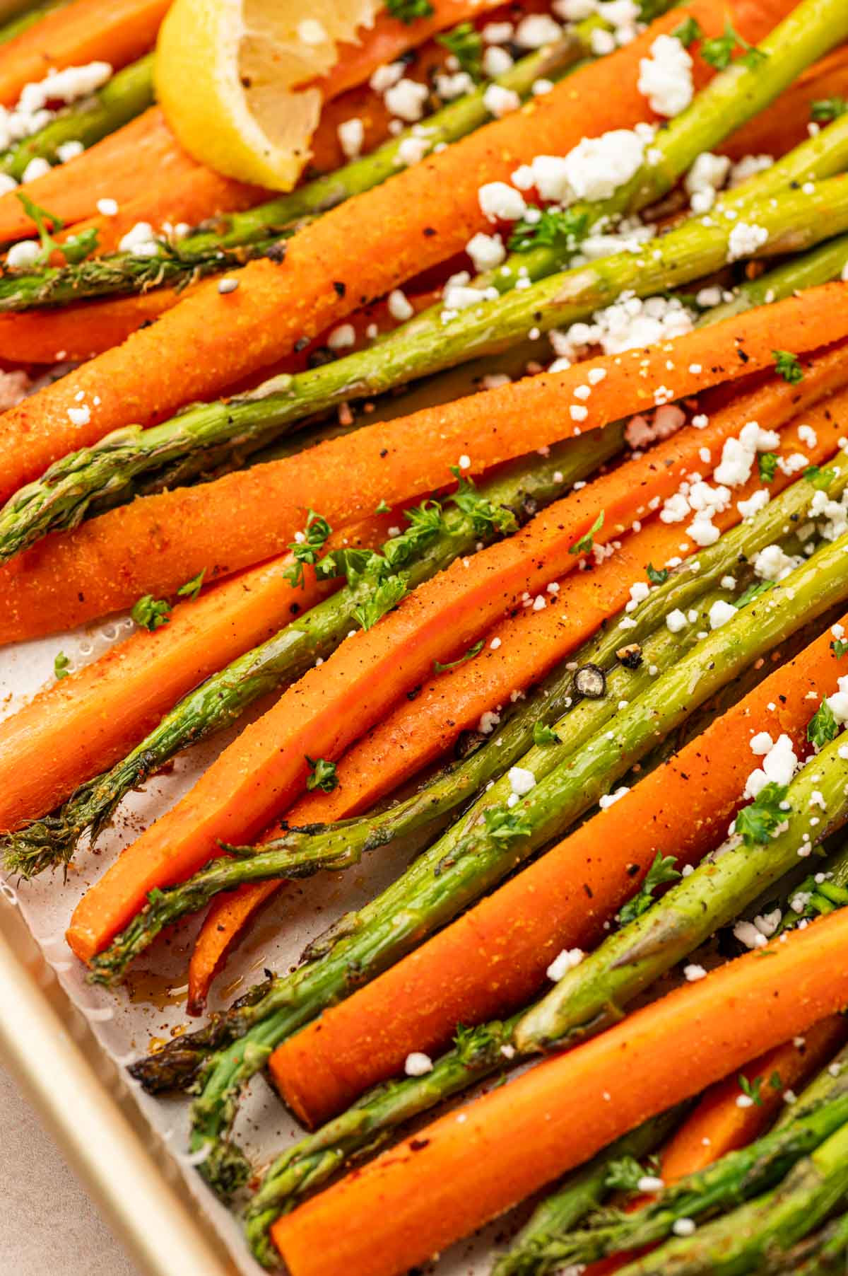 CLose up shot of quick and easy roasted carrots and asparagus recipe.