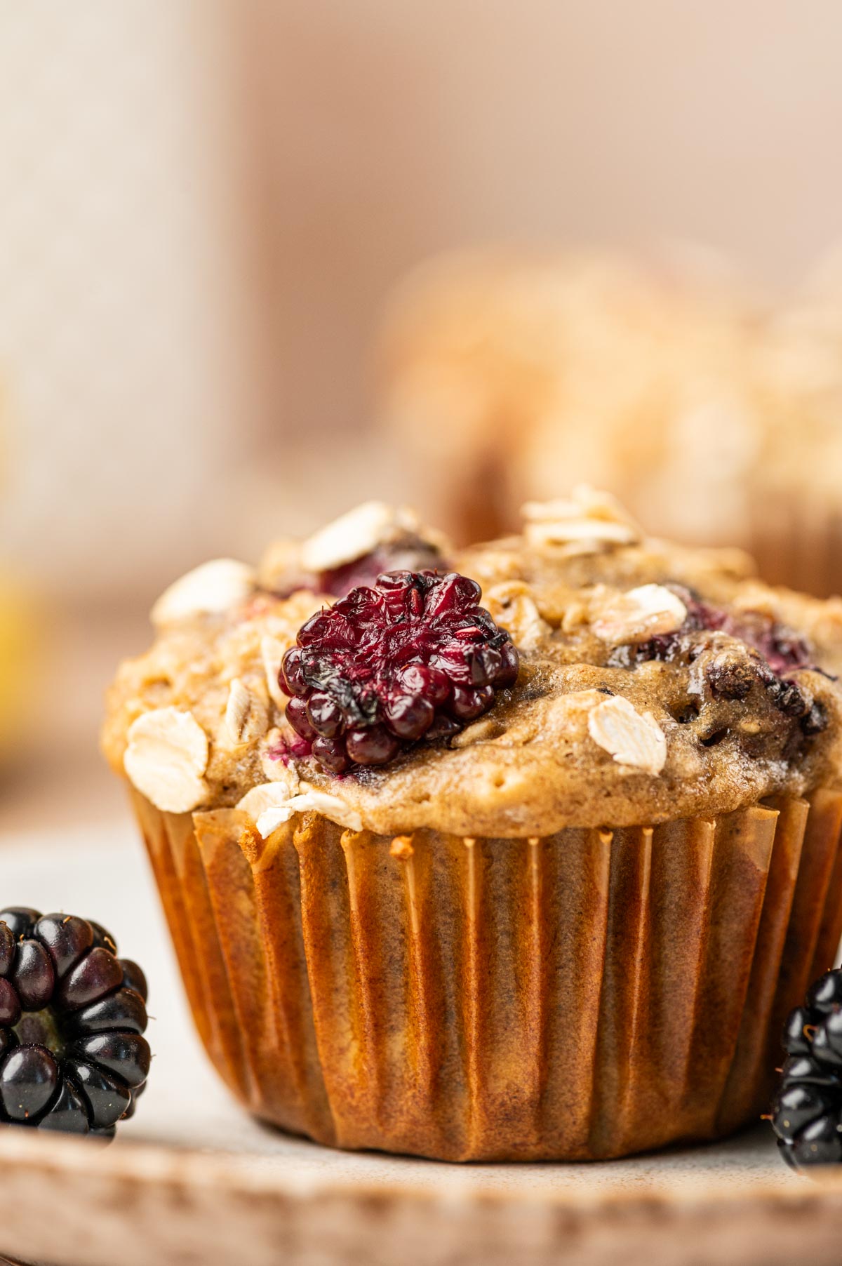 Close up shot of blackberry banana oatmeal muffins.