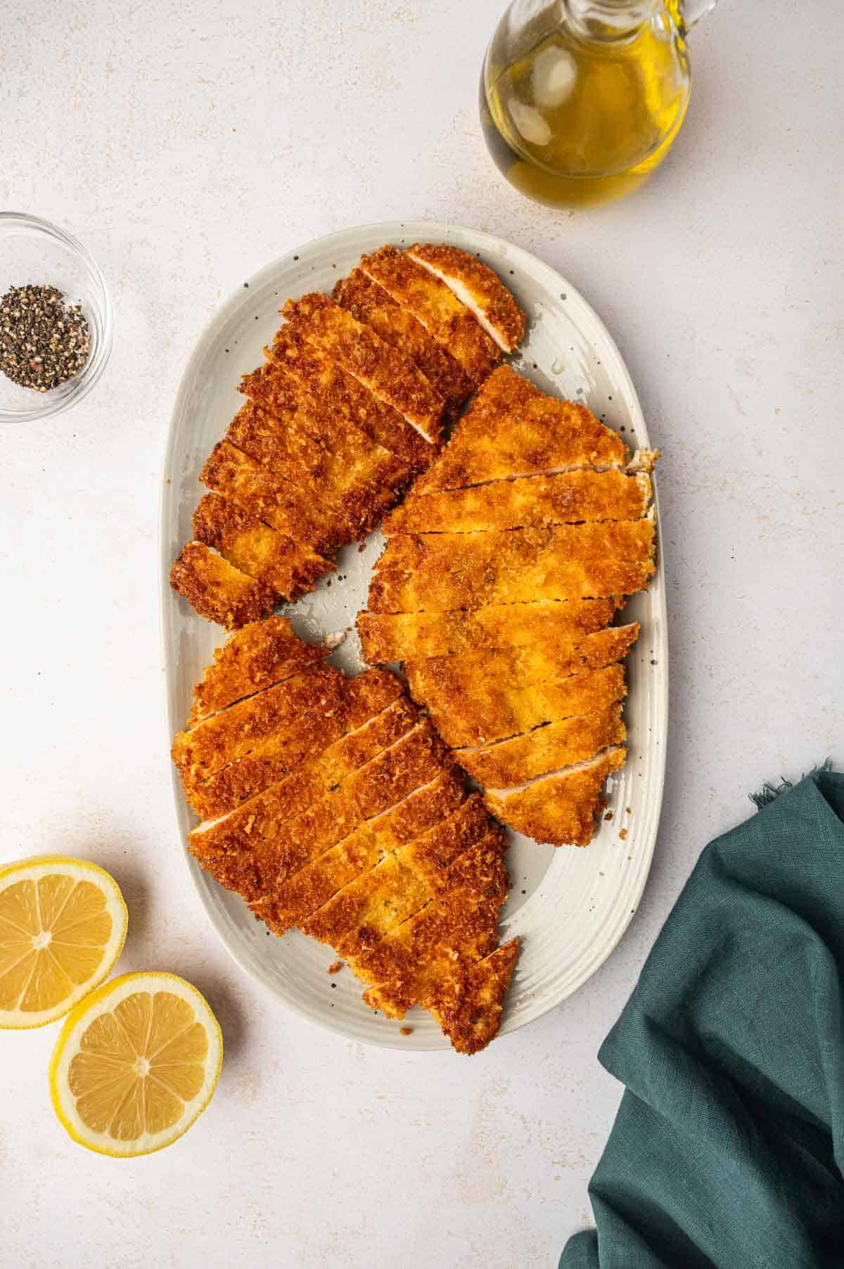 In a gray oval platter the crispy is sliced and placed.