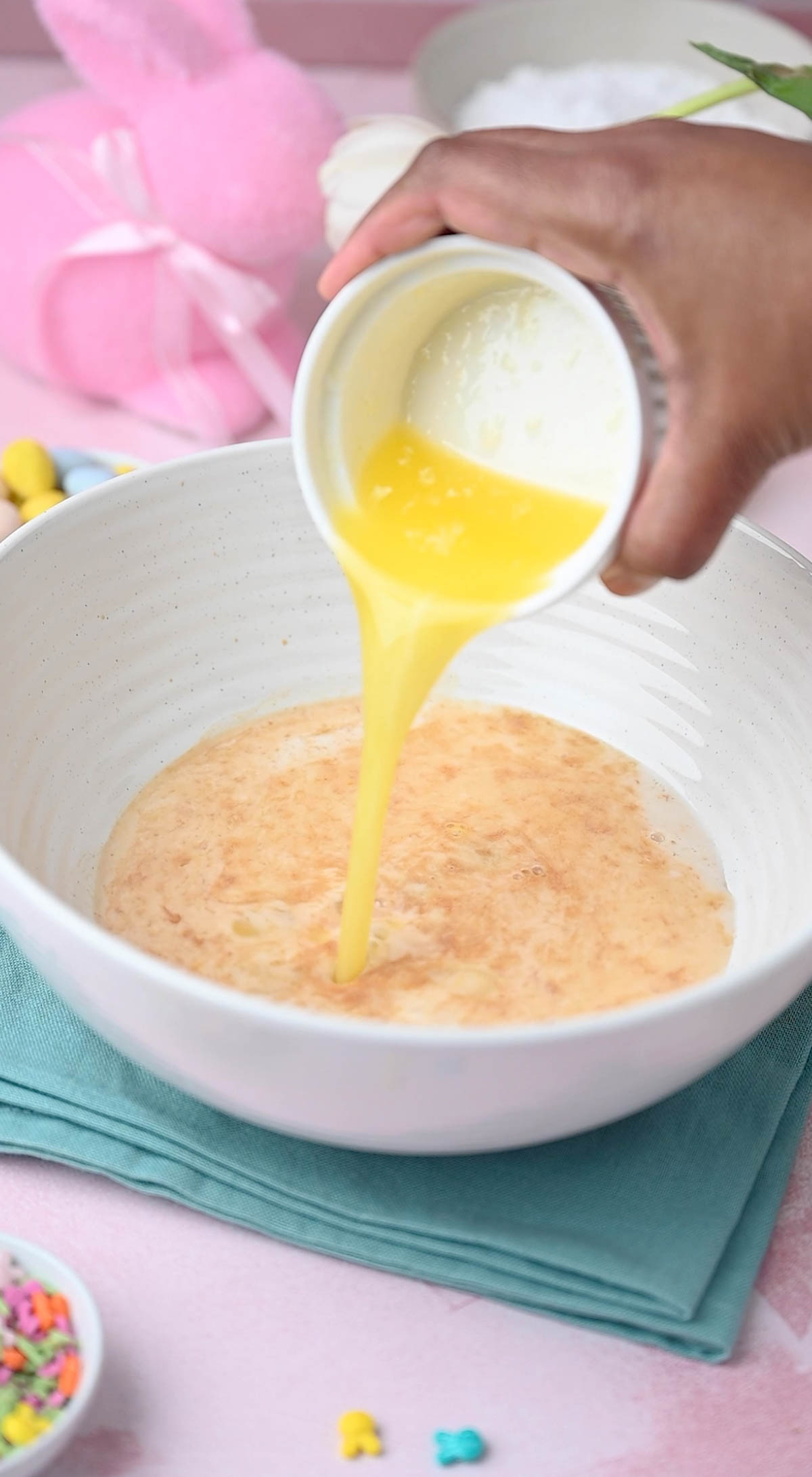 Wet ingredients being combined for making easter donuts recipe.