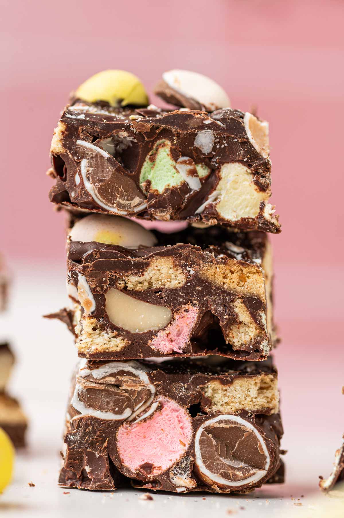 Rocky Road with easter themed fudge stacked one above the other beautifully loaded with mini marshmallows and mini eggs chocolate.