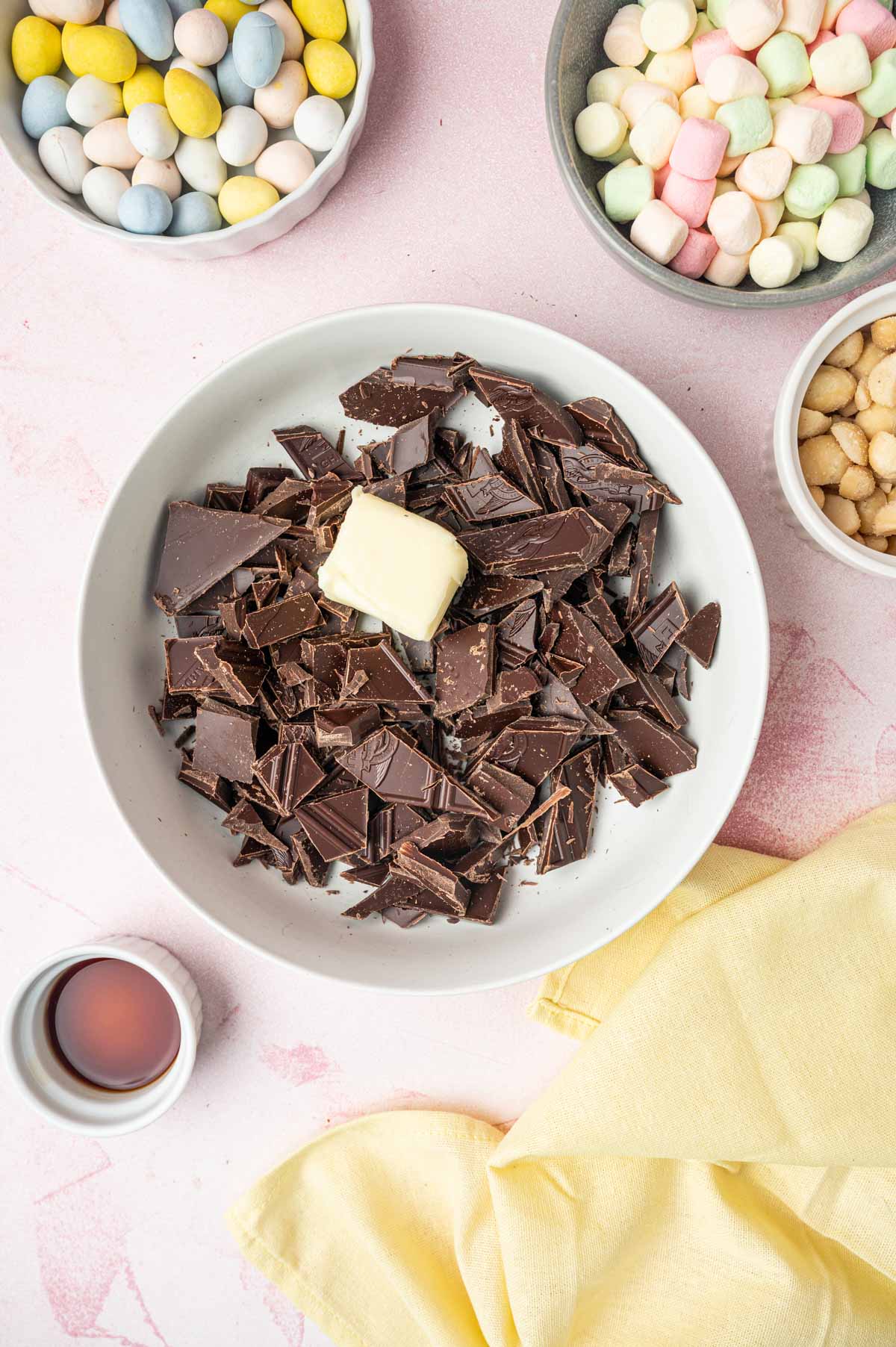 Chocolate combined in a bowl with butter to make rocky road recipe for easter.