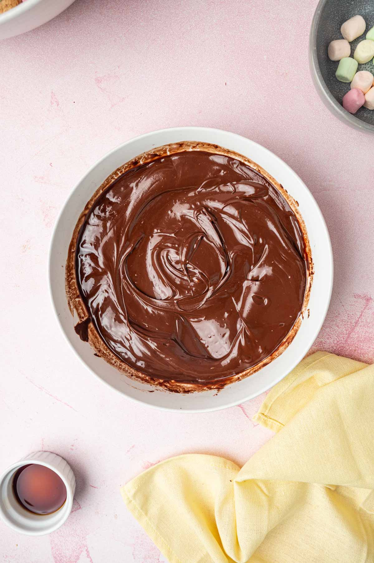 Melted chocolate in a white bowl.