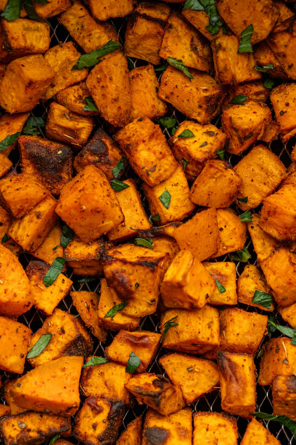 Overhead view of air-fried sweet potato cubes  cooked in the air fryer.