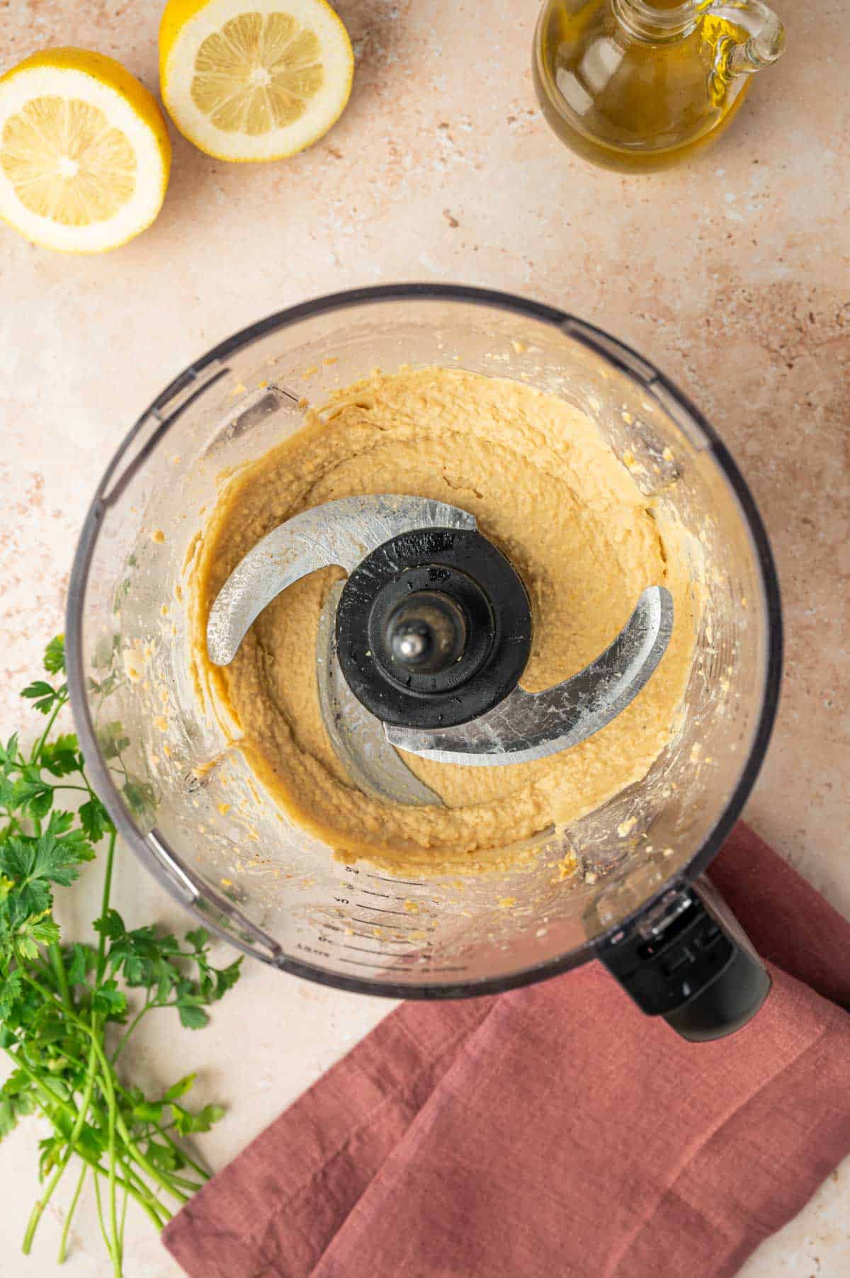 In a fod processor the hummus being processed without salt.